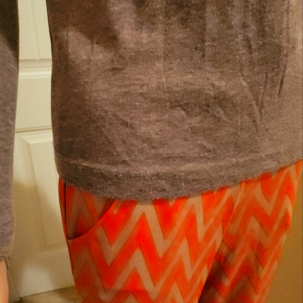A grayish brown long sleeve V-neck T-shirt.